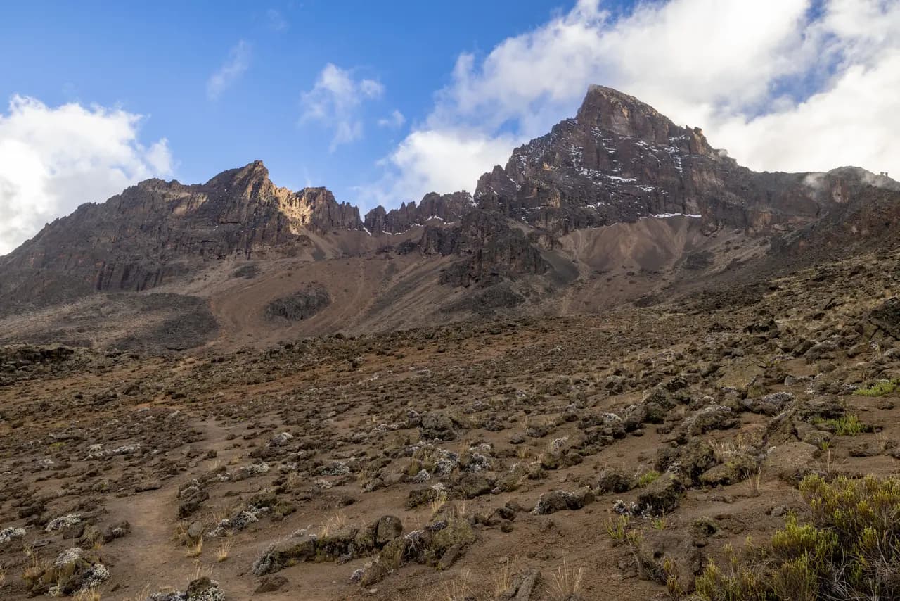 Majestic volcanic mountain landscape with rugged peaks and clear skies